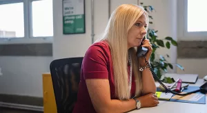 Woman using a desk phone